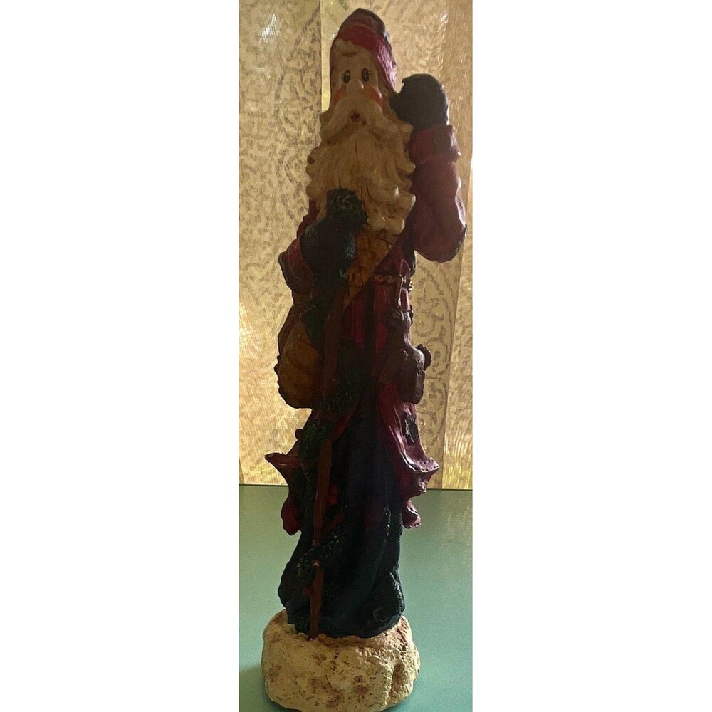 Vintage rustic, resin pencil Santa with toy bag